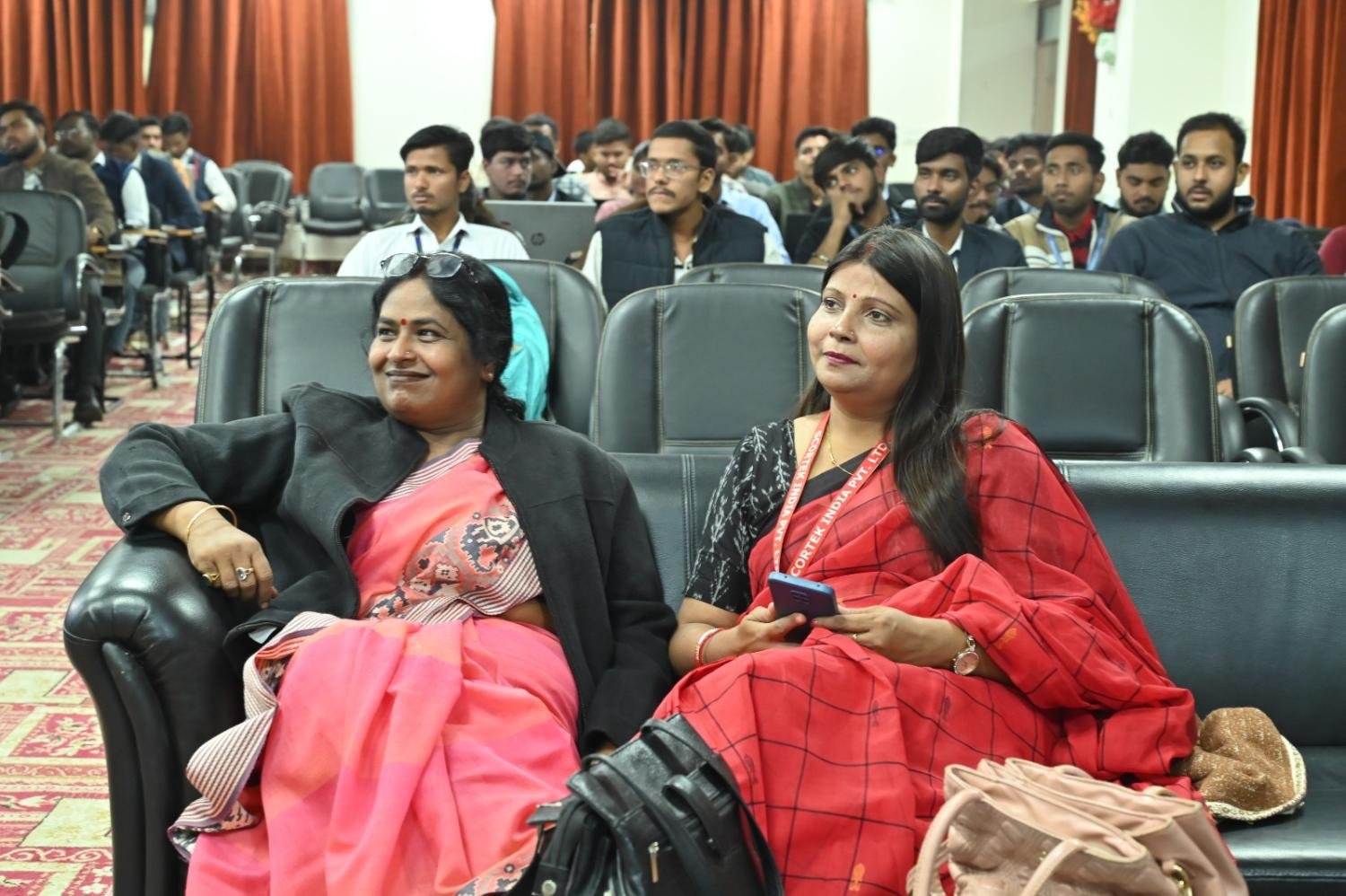 Guests seated at a campus technical event