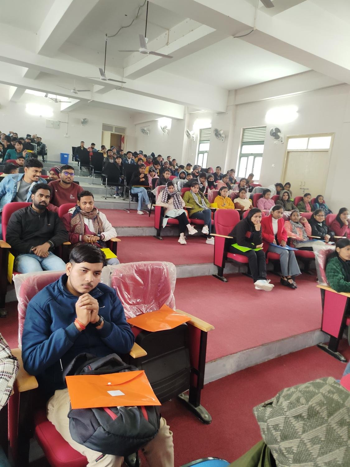 Students seated for a technical session in the auditorium